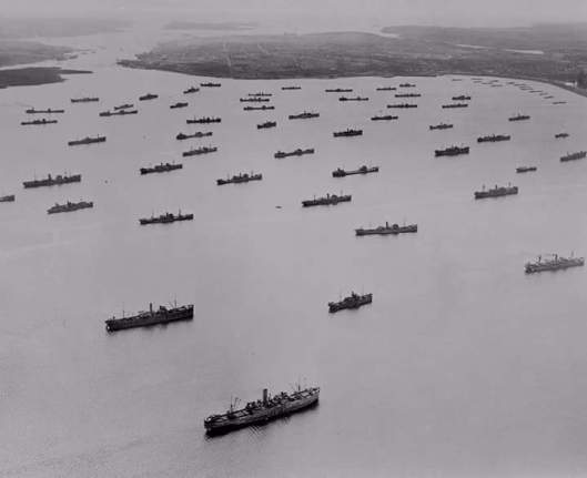 An Allied convoy assembled in Bedford Basin, NS, preparing to cross the ocean during The Battle of the Atlantic.